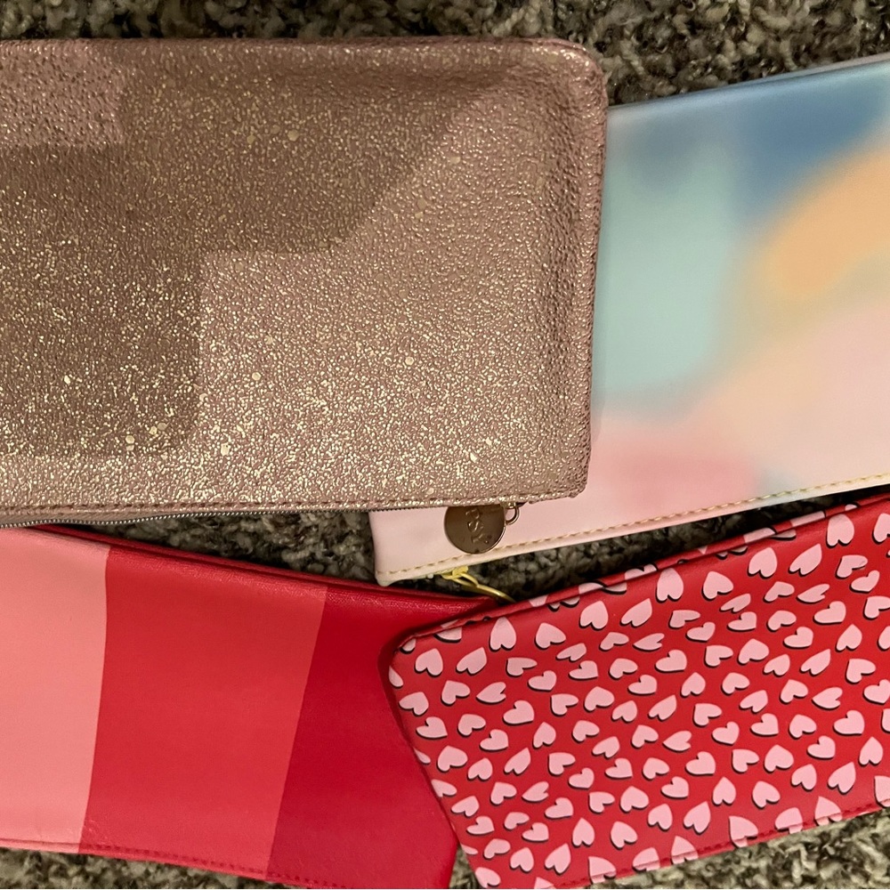 Assorted face masks and Ipsy bags